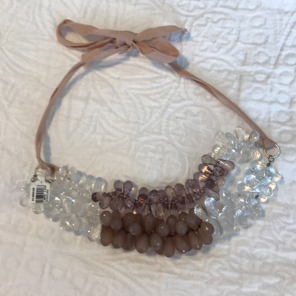 Loft necklace with mauve, plums, and clear beads.